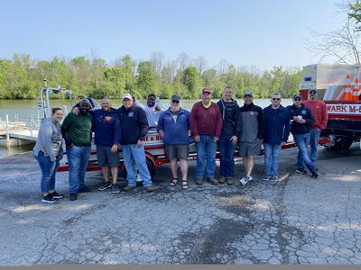 FIrefighers in front of rescue boat
