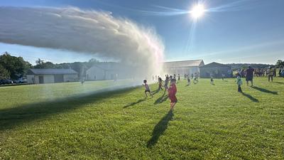 Fire Department - Spraying water for kids in hot weather
