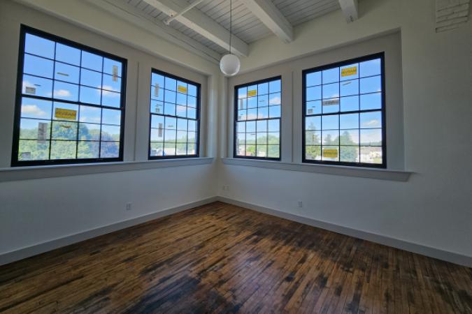 Coventry Commons Inside Corner with 4 windows in living room 6.23.26