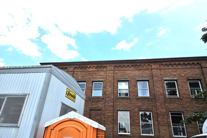 Coventry Commons outside wall of larger building