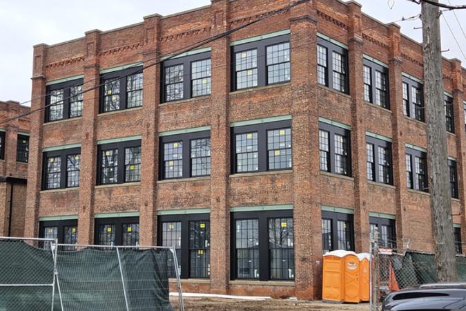 132 Harrison St Coventry Commons Building to the East 1.14.2026